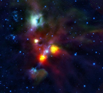  NGC 1999 to zielonkawa mgławica na górze zdjęcia. Do niedawna widoczna na jej tle ciemna plama uważana była za gęsty, nieprzepuszczający prominiemiowanie obłok pyłowy. Obserwacje teleskopem Herschela pokazały, że to.... dziura w mgławicy!  Zdjęcie jest złożeniem obserwacji  instrumentu PACS satelity Herschel  (70 i 160 mikometów) oraz  kamery NEWFIRM (1,6 i 2,2 mikrometrów) umieszczonej na 4-metrowym teleskopie na Kitt Peak, USA. Źródło: ESA/HOPS Consortium