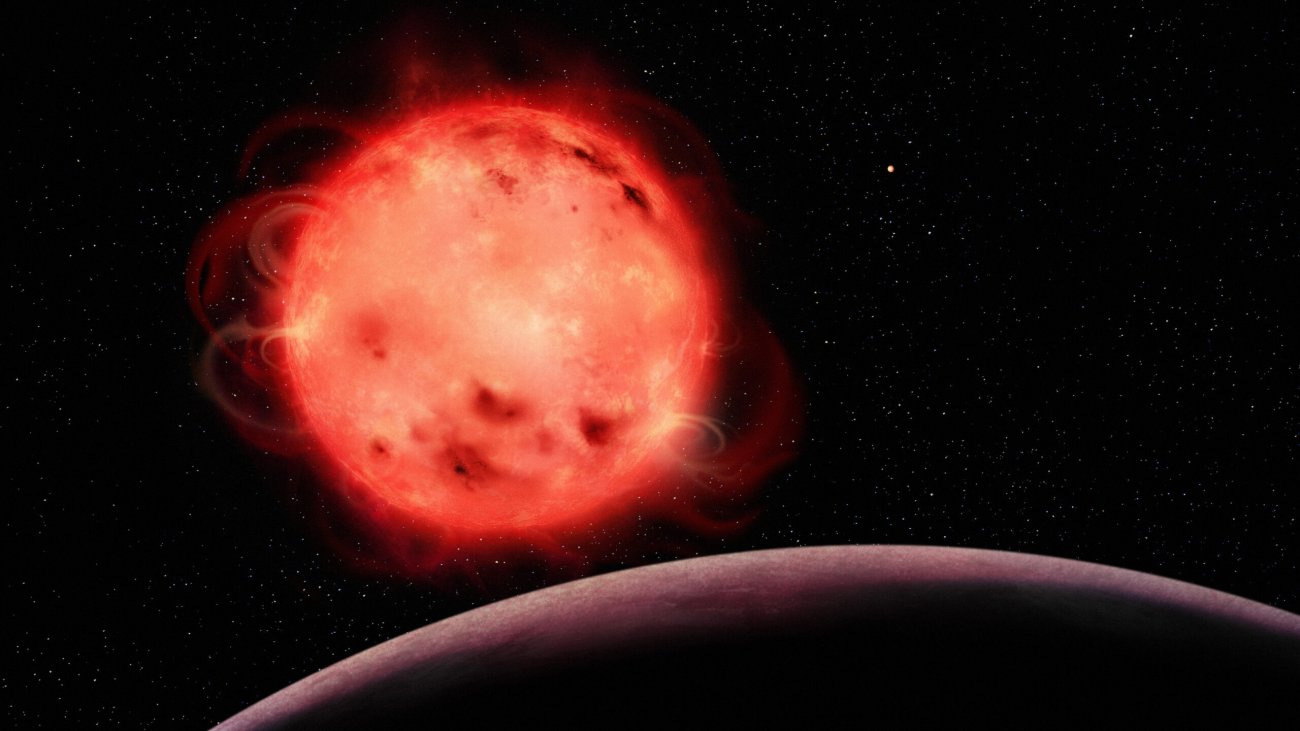 Wizja artystyczna czerwonego karła TRAPPIST-1 pokazująca jego bardzo aktywną naturę.