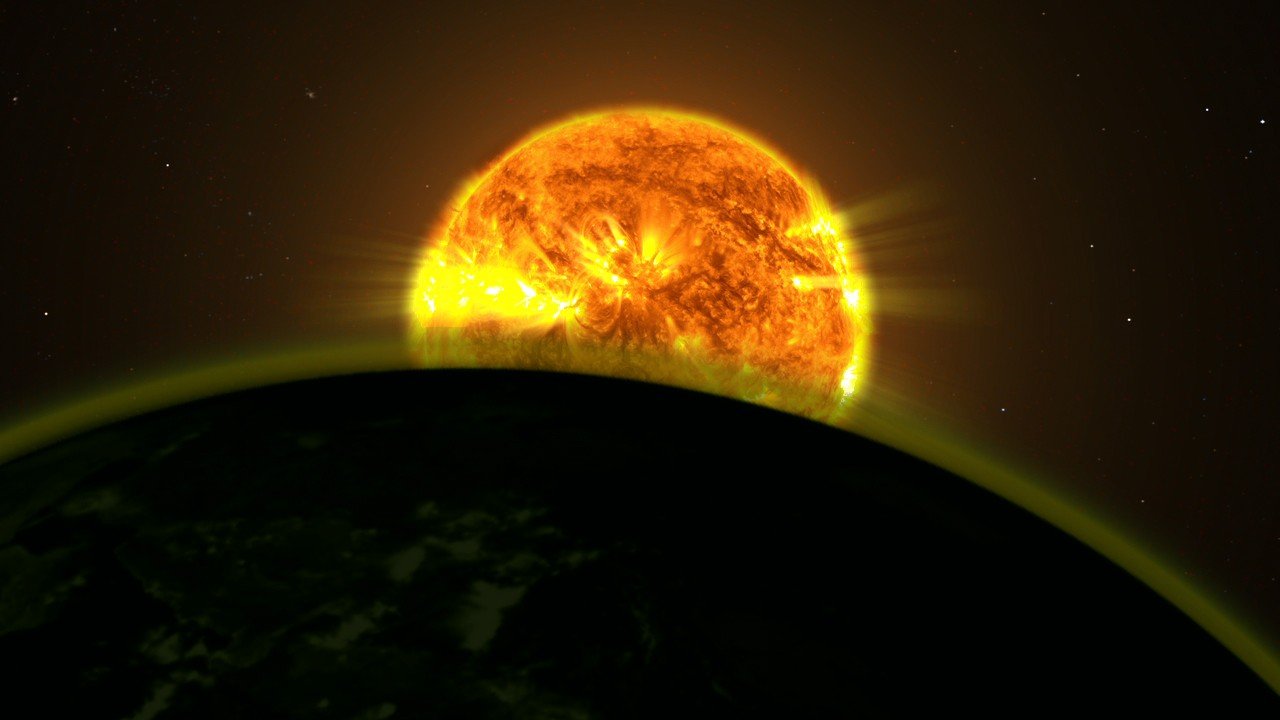 Światło gwiazdy rozświetla atmosferę egzoplanety (wizja artystyczna)
