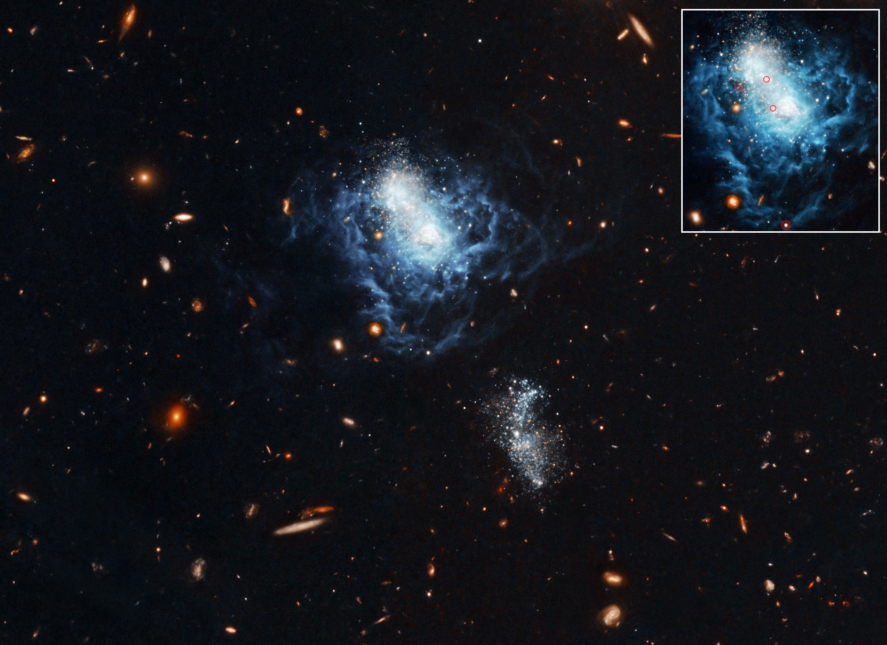 Na ilustracji: W centrum pola widzenia widać nieregularną galaktykę karłowatą I Zwicky 18 sfotografowaną około 2007 roku przez Teleskop Hubble w „sztucznych” kolorach (barwa niebieska → λ~0,66μm, barwa pomarańczowa → λ~0,814μm). Poniżej I Zw 18 – nieco po prawej stronie, znajduje się mniejsza galaktyka towarzysząca podobnego typu, która skrzy się białymi i niebieskimi gwiazdami. We wstawce u góry po prawej stronie widać galaktykę I Zw 18 z zaznaczonymi w czerwonych okręgach cefeidami, które pozwoliły wyznaczyć dokładnie odległość do  tej galaktyki (zwiększyła się ona do 59 mln. l.św. - o prawie 10 mln l.św. więcej względem wcześniejszych wyznaczeń). Źródło: NASA, ESA and A. Aloisi (ESA/STScI