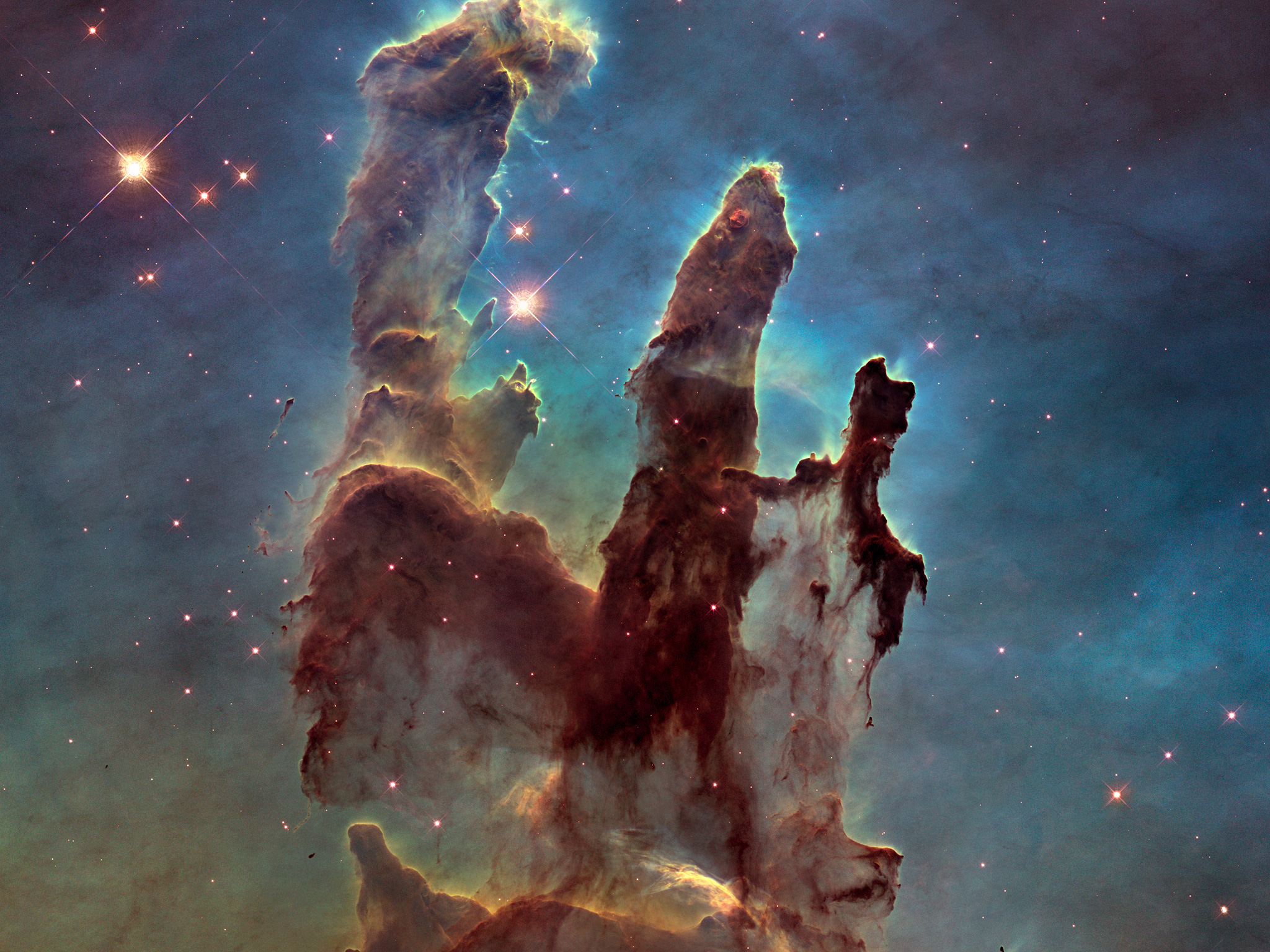 Najbardziej szczegółowy obraz Filarów Stworzenia w zakresie widzialnym zarejestrowany przez Teleskop Kosmiczny Hubble’a w 2014 roku. Źródło: NASA, ESA and the Hubble Heritage Team (STScl/AURA)
