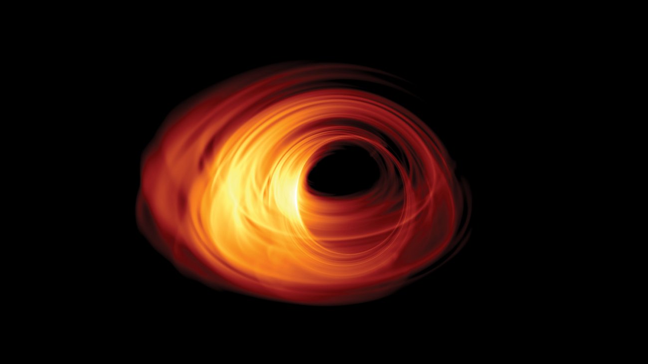 Symulacja obrazu akreującej czarnej dziury. Horyzont zdarzeń znajduje się w centrum obrazu. Cień czarnej dziury można zobaczyć z obracającym się dyskiem akrecyjnym, który ją otacza. Źródło: Bronzwaer/Davelaar/Moscibrodzka/Falcke/Radboud University.