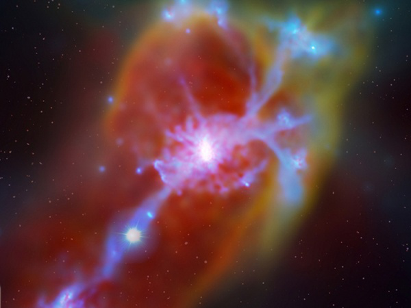 Obraz galaktyki z napływem schłodzonego gazu, wygenerowane poprzez rendering procesu rozkładu gazu w symulacji komputerowej. Strumień pierwotnego, wpływającego gazu jest podświetlany od tyłu przez światło kwazara (widoczny jest on po lewej na samym dole, i podobnie jak inne gwiazdy tła został sztucznie dodany do obrazu samej symulacji). Wykorzystując dane zebrane przez Teleskop Kecka naukowcy dokonali pierwszej jednoznacznej detekcji akrecji pierwotnego gazu na galaktykę, w której miały miejsce intensywne p