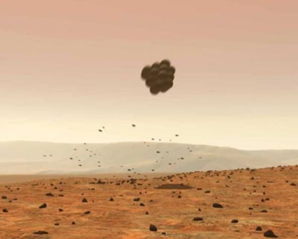 Rysunek wyobrażający jak wyposażony w poduszki powietrzne Spirit opada na czerwona planetę. Taka samą ochronę zastosowano 7 lat temu w misji Pathfinder. Źródło: NASA