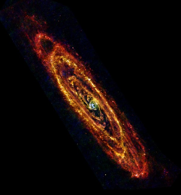 Obraz Galaktyki Andromedy uzyskany na podstawie obserwacji Kosmicznego Obserwatorium Herschela. Ta galaktyka, znana również jako M31, jest najbliższą sąsiadką naszej Drogi Mlecznej. Dzięki temu stała się idealnym celem obserwacji w zakresie podczerwonym, dostarczając informacji na temat procesów powstawania gwiazd i ewolucji galaktyk. Źródło: NASA