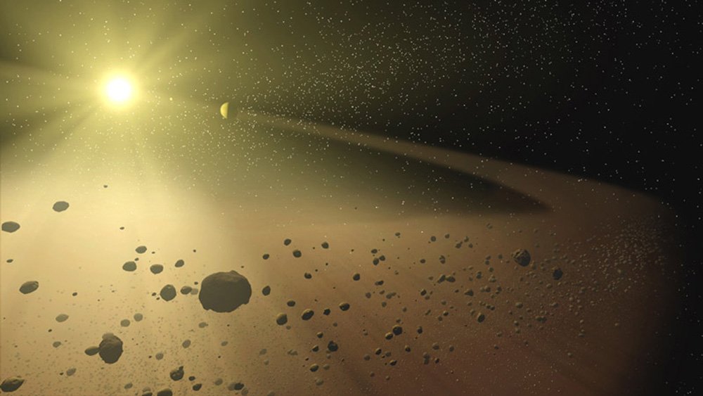 Wizja artystyczna wąskiego pasa asteroid pełnego skał oraz pyłowego gruzu okrążającego gwiazdę podobną do naszego Słońca. Źródło: NASA/JPL-Caltech