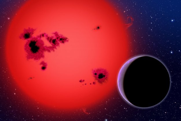 Wizja artysty przedstawiająca nowoodkrytą super-Ziemię GJ 1214b, która okrąża czerwonego karła w odległości 40 lat świetlnych od Ziemi. Źródło: Harvard-Smithsonian Center for Astrophysics 