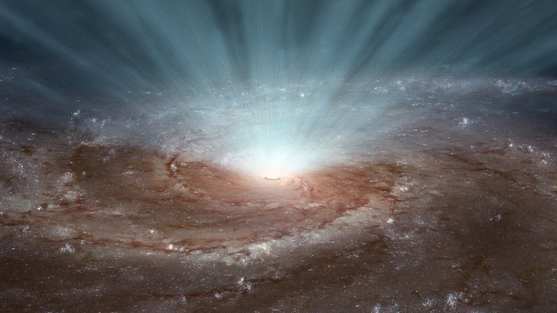 Wiatry z supermasywnej czarnej dziury w galaktyce uciekają w przestrzeń kosmiczną.