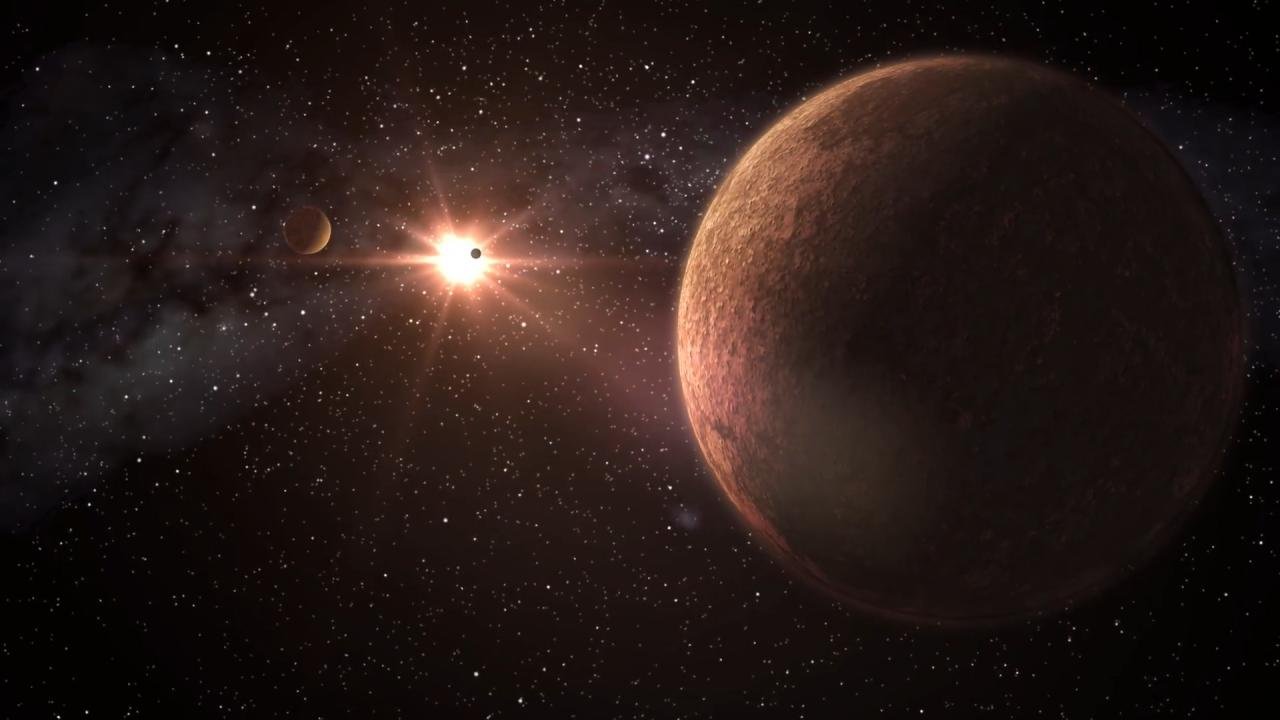 Wizja artystyczna układu planetarnego złożonego ze skalistych planet o niskiej masie krążących wokół swojej gwiazdy.