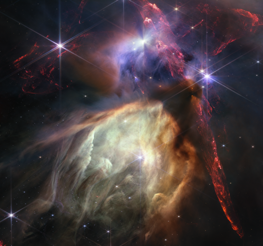 Na ilustracji: Zdjęcie pełne rodzących się gwiazd w Mgławicy Ro Ophiuchi z dramatyczną kolorystyką i szczegółowością nigdy jeszcze nie oglądaną, które zostało opublikowane w dniu 12 lipca 2023 roku z okazji pierwszej rocznicy rozpoczęcia obserwacji naukowych Teleskopem Webba. Mgławica Ro Ophiuchi jest najbliższym Ziemi obszarem gwiazdotwórczym. Źródło: NASA, ESA, CSA, STScI, Klaus Pontoppidan (STScI)