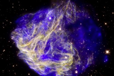 Obraz złożony z kilku zdjęć przedstawiający N49, pozostałość po wybuchu supernowej w Wielkim Obłoku Magellana.   Źródło: X-ray: NASA/CXC/Penn State/S. Park et al. Optical: NASA/STScI/UIUC/Y.H. Chu & R. Williams et al
