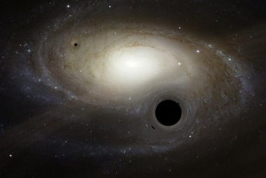 Wizja artystyczna kilku czarnych dziur o masie pośredniej poruszających się w pobliżu galaktyki.