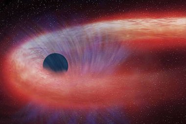 Rozerwanie pływowe gwiazdy przez czarną dziurę.